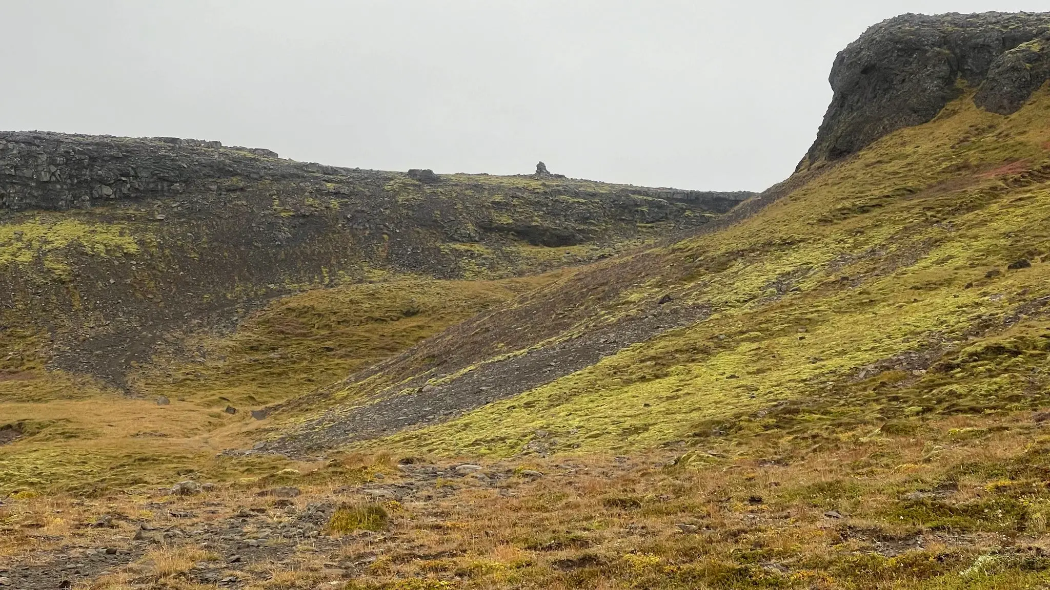 Access the summit plateau via a break in the rock face