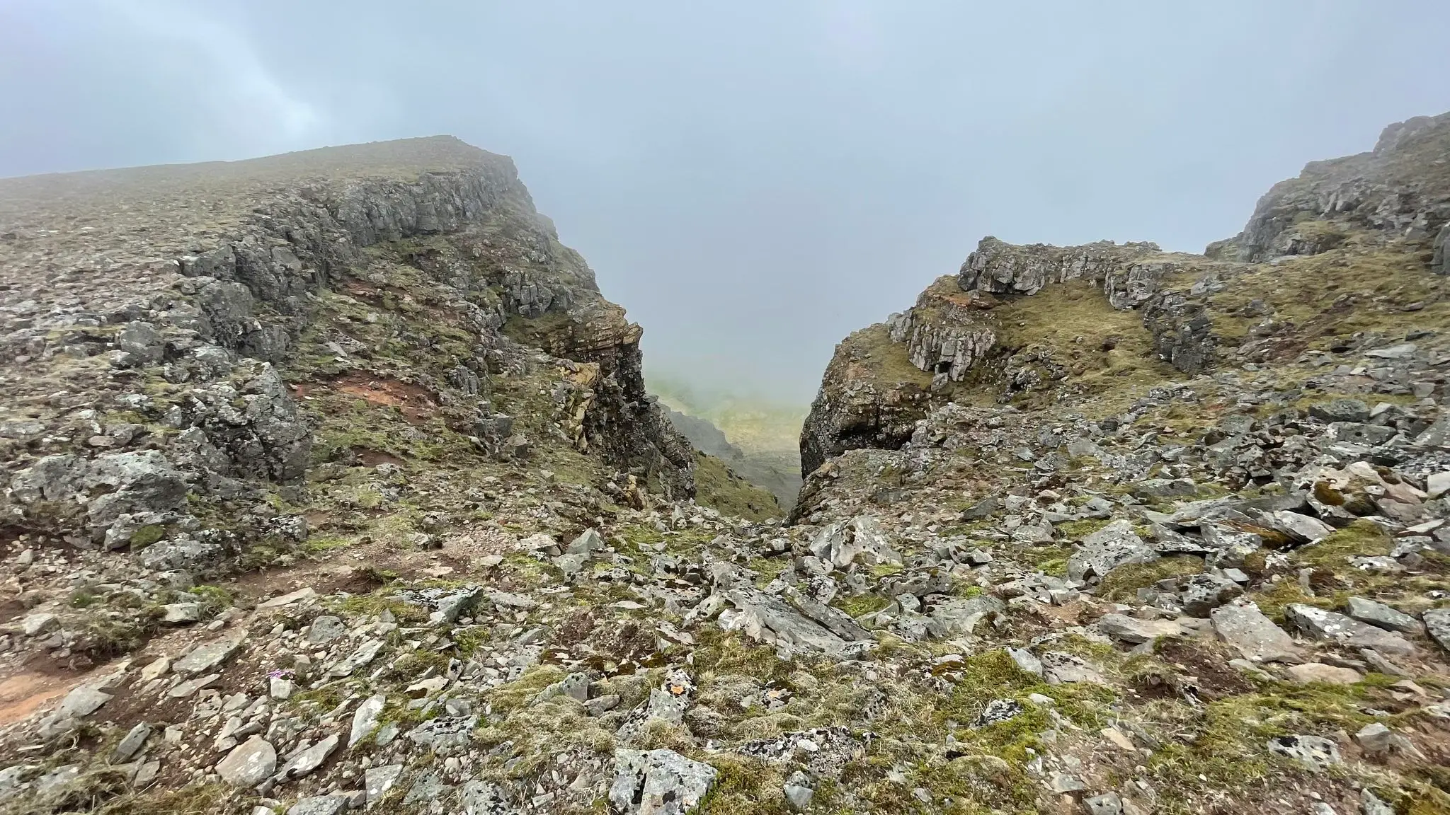 Trail skirts by a deep gully