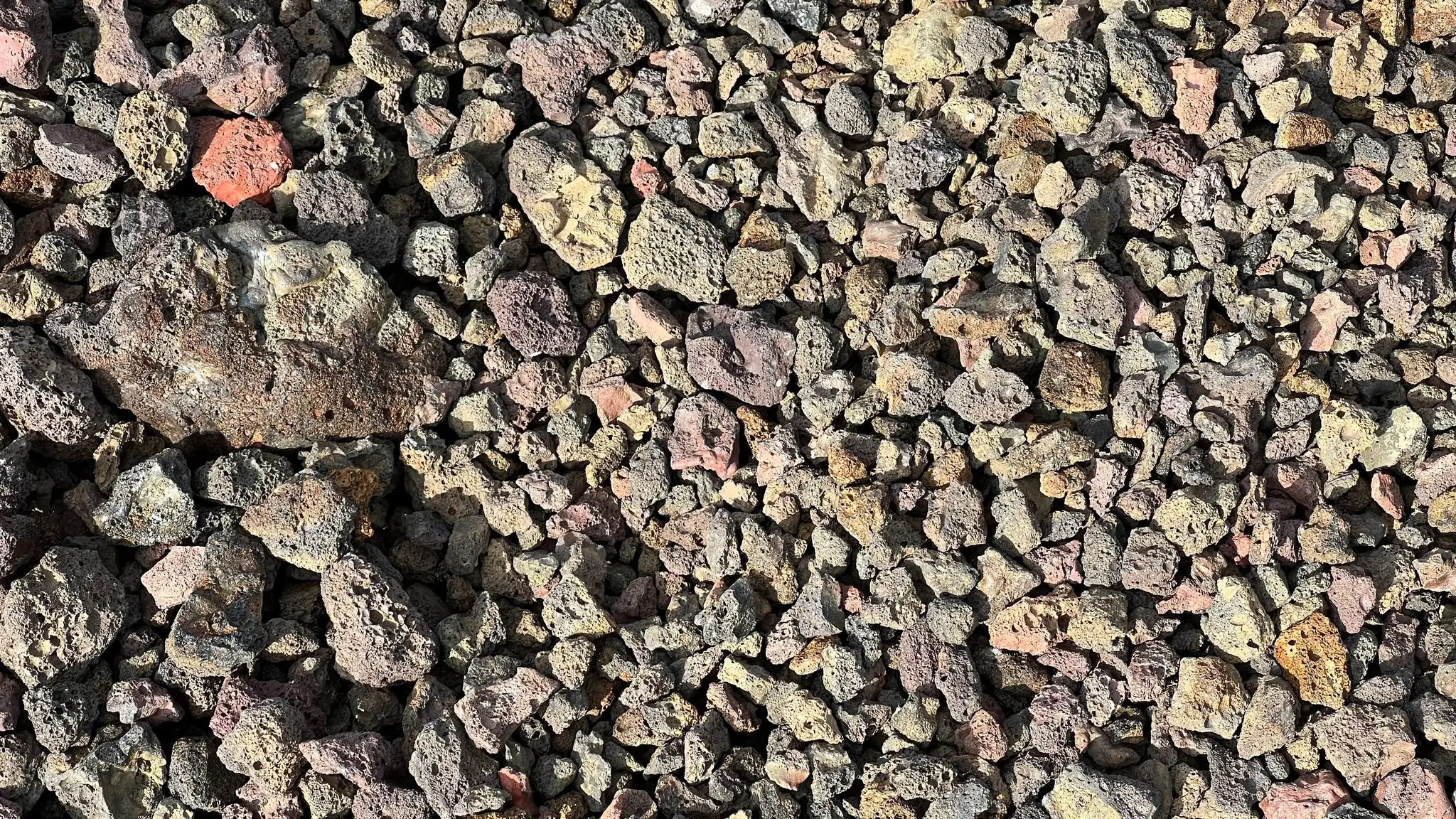 Loose multi-colored scoria underfoot