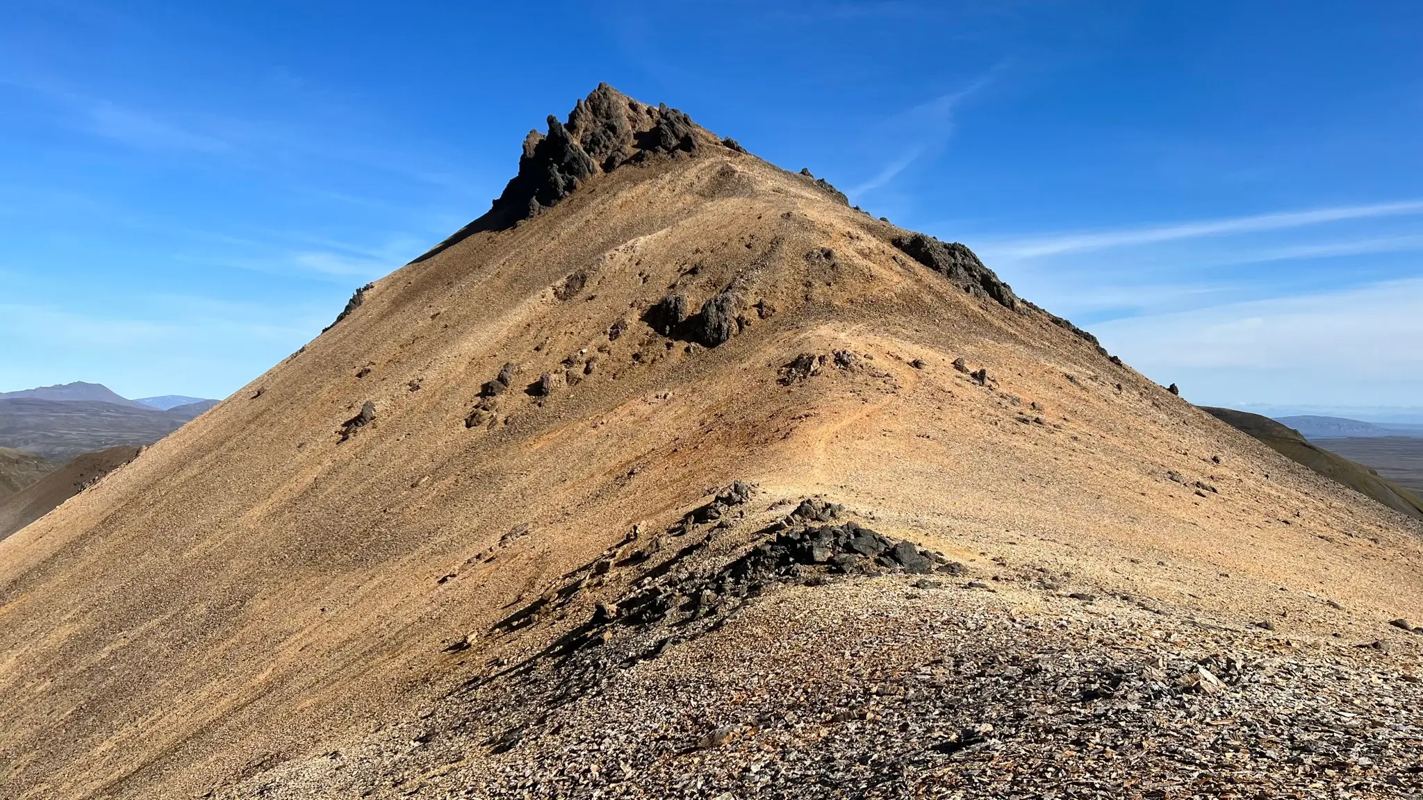 Looking back at the descent from the middle peak