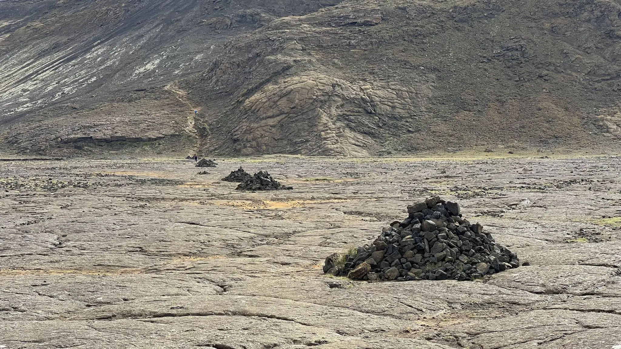Follow the cairns across the rock bed