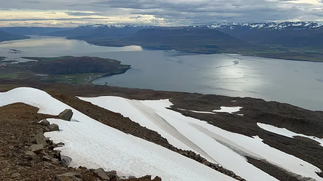 Bare scree and lingering snowfields on the upper slopes of Kaldbakur, high above Eyjafjörður